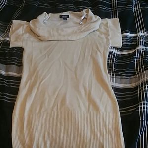 A long sparkly cream colered sweater